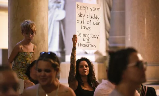 Demonstrators stand outside the House chamber before a vote is held on Senate Bill 1 during a special session Friday, Aug. 5, 2022, at the Indiana Statehouse in Indianapolis. Critics of religious freedom laws often argue they are used to discriminate against LGBTQ people and only protect a conservative Christian worldview. But following the U.S. Supreme Court’s overturning of Roe v. Wade in June, religious abortion-rights supporters are using these laws to protect access to abortion and defend