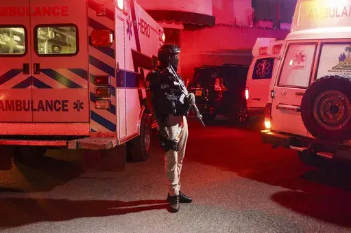 Police guard outside the hospital where Haiti's newly selected prime minister, Garry Conille was hospitalized in Port-au-Prince, Haiti, late Saturday, June 8, 2024. Louis Gérald Gilles, a member of the transitional presidential council that recently chose Conille said he was en route to the hospital and did not have further information. (AP Photo/Odelyn Joseph)
