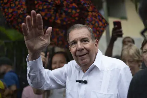Venezuelan opposition presidential candidate Edmundo Gonzalez waves to supporters during a political event at a square in the Hatillo municipality of Caracas, Venezuela, June 19, 2024. (AP Photo/Ariana Cubillos, File)