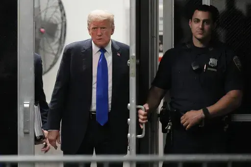 Former President Donald Trump returns to the courtroom at Manhattan Criminal Court, May 30, 2024, in New York. Americans are about evenly split on whether Trump should face prison time for his recent felony conviction on hush money charges, according to a new poll from the AP-NORC Center for Public Affairs Research conducted June 20-24. (AP Photo/Seth Wenig, Pool)