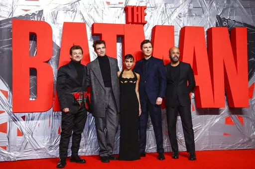 Andy Serkis, from left, Robert Pattinson, Zoe Kravitz, Paul Dano and Jeffrey Wright pose for photographers upon arrival for the screening of the film 'The Batman' in London Wednesday, Feb. 23, 2022. (Photo by Joel C Ryan/Invision/AP)