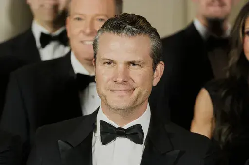 Pete Hegseth, President-elect Donald Trump's choice to be Defense Secretary, poses for a photo with Cabinet picks, other nominees and appointments, at the National Gallery of Art in Washington, Saturday, Jan. 18, 2025. (AP Photo/Mark Schiefelbein)