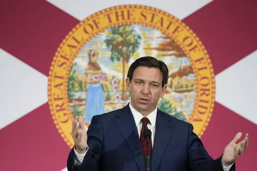 Florida Gov. Ron DeSantis speaks during a news conference in Miami, Tuesday, May 9, 2023. Videos circulating on social media purport to show empty Florida grocery stores due to a boycott of truck drivers over an immigration bill recently signed by DeSantis. However, while some truckers have threatened to stop deliveries in the state, these grocery aisles are empty for reasons that are unrelated to the recent bill. (AP Photo/Rebecca Blackwell, File)