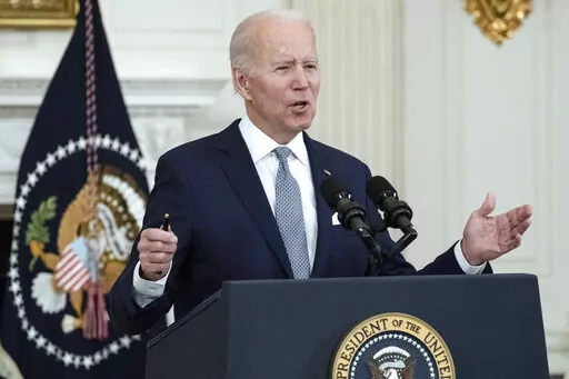 President Joe Biden speaks about the 2021 jobs report in the State Dining Room of the White House, Friday, Jan. 7, 2022, in Washington. (AP Photo/Alex Brandon)