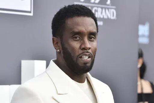 Music mogul and entrepreneur Sean "Diddy" Combs arrives at the Billboard Music Awards, May 15, 2022, in Las Vegas. Two properties belonging to Combs’ in Los Angeles and Miami were searched Monday, March 25, 2024, by federal Homeland Security Investigations agents and other law enforcement as part of an ongoing sex trafficking investigation, two law enforcement officials told The Associated Press. (Photo by Jordan Strauss/Invision/AP, File)