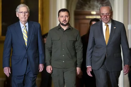 Ukrainian President Volodymyr Zelenskyy, center, walks with Senate Minority Leader Mitch McConnell of Ky., left, and Senate Majority Leader Chuck Schumer of N.Y., right, at Capitol Hill on Thursday, Sept. 21, 2023, in Washington. (AP Photo/Mark Schiefelbein, File)