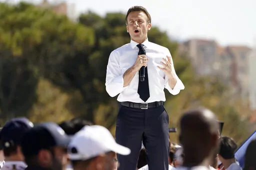 French President and centrist candidate Emmanuel Macron speaks during a campaign rally, Saturday, April 16, 2022 in Marseille, southern France. Far-right leader Marine Le Pen is trying to unseat centrist President Emmanuel Macron, who has a slim lead in polls ahead of France's April 24 presidential runoff election. (AP Photo/Laurent Cipriani)