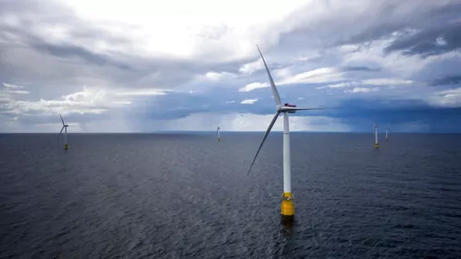 Hywind Scotland, the world's first commercial wind farm using floating wind turbines, is visible off the coast of Scotland in August 2017. Tuesday, Dec. 6, 2022, marks the first-ever U.S. auction for leases to develop commercial-scale floating wind farms in the deep waters off the West Coast. (Woldcam/Equinor via AP)