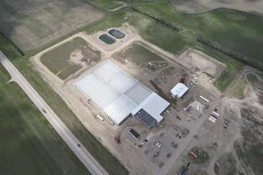 This aerial photo shows the first phase of the Mandan, Hidatsa and Arikara Nation's Native Green Grow greenhouse operation on May 15, 2024, near Parshall, N.D. The greenhouse is planned for growing large quantities of leafy greens and vine crops for exports, distribution on the Fort Berthold Indian Reservation, to other tribes in neighboring states and food banks for isolated and impoverished areas. (RML Architects via AP)