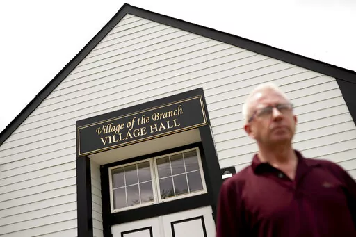 Mark Delaney, Mayor of Village of the Branch, a village in the Town of Smithtown in Suffolk County, stands outside Village Hall, Thursday, June 2, 2022, in Smithtown, N.Y. From small towns to big cities, every government across the U.S. was offered a slice of $350 billion of federal coronavirus relief funds intended to help shore up their finances, fight the virus and invest in community projects. Nearly 1,500 local government said "no," turning down a total of about $60 million of aid, accordin