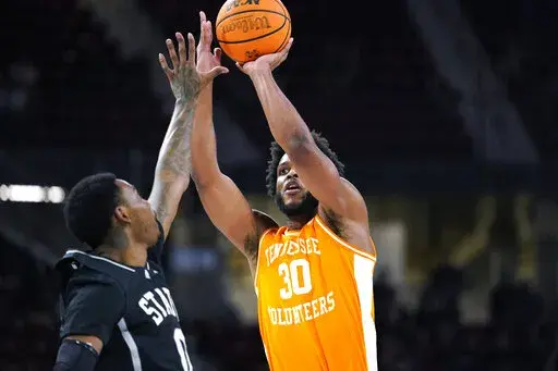 Tennessee guard Josiah-Jordan James (30) shoots over Mississippi State forward D.J. Jeffries (0) during the first half of an NCAA college basketball game in Starkville, Miss., Tuesday, Jan. 17, 2023. (AP Photo/Rogelio V. Solis)