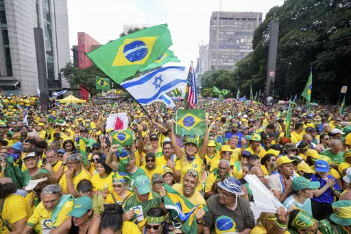 Followers of former Brazilian President Jair Bolsonaro rally to express their support for him in Sao Paulo., Brazil, Sunday, Feb. 25, 2024. Bolsonaro and some of his former top aides are under investigation into allegations they plotted a coup to remove his successor, Luis Inacio Lula da Silva. (AP Photo/Andre Penner)