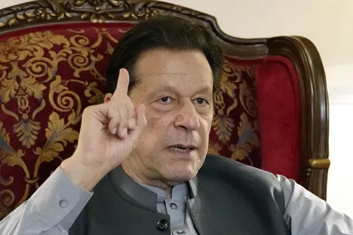 Pakistan's former Prime Minister Imran Khan gestures during talk with reporters regarding the current political situation and the ongoing cases against him at his residence, in Lahore, Pakistan, Thursday, Aug. 3, 2023. Khan awoke Sunday, Aug. 6, 2023, as an inmate in a high-security prison after a court handed him a three-year jail sentence for corruption, a development that could end his future in politics. (AP Photo/K.M. Chaudary, File)
