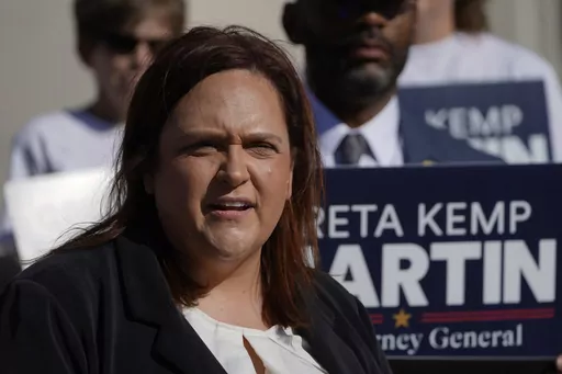 Greta Kemp Martin, the Democratic nominee for attorney general, speaks to reporters at a news conference, Tuesday, Oct. 24, 2023, in Jackson, (AP Photo/Rogelio V. Solis)