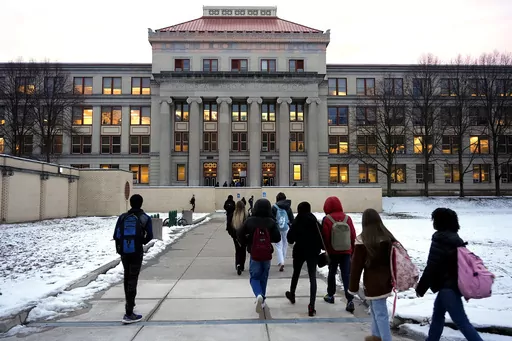 Students arrive for classes at Taylor Allderdice High School in the Squirrel Hill neighborhood of Pittsburgh, Tuesday, Jan. 23, 2024. The mother of an intellectually disabled girl who allegedly was led from school grounds by three male students and sexually assaulted in a Starbucks bathroom and a nearby empty building has filed a lawsuit Wednesday, Jan 24, 2024, accusing Starbucks, Pittsburgh Public Schools and a property management company of negligence. (AP Photo/Gene J. Puskar)