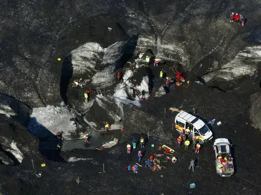 Rescue teams work at the scene after an ice cave partially collapsed, at the Breidamerkurjokull glacier, in southeastern Iceland, Monday, Aug, 26, 2024. (STOD2/ Vilhelm Gunnarsson via AP)
