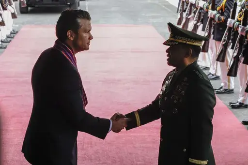 U.S. Defense Secretary Pete Hegseth and Armed Forces of the Philippines Chief of Staff General Romeo Brawner shake hands upon Hegseth's arrival at the Armed Forces of the Philippines Headquarters in Camp Aguinaldo in Quezon City, Philippines, Friday, March 28, 2025. (AP Photo/Gerard Carreon)