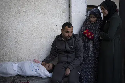 Palestinians mourn a child killed in the Israeli bombardment of the Gaza Strip at a hospital morgue in Rafah, Monday, Feb. 12, 2024. (AP Photo/Fatima Shbair, File)