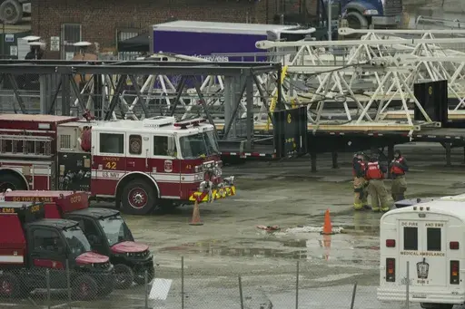Emergency vehicles are seen across the Potomac River near Ronald Reagan Washington National Airport, Friday, Jan. 31, 2025, in Washington. (AP Photo/Carolyn Kaster)