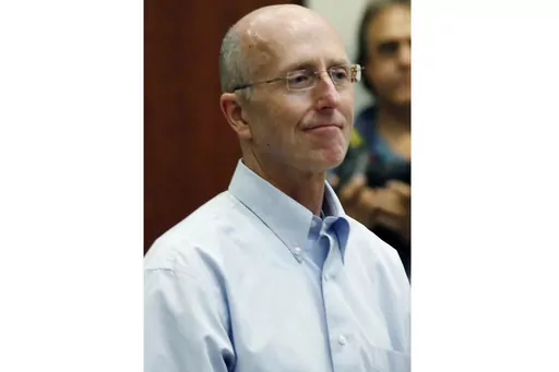 In this file photo from May 22, 2014, Mark Mayfield appears in court in Madison, Miss. A federal appeals court ruled Wednesday, Aug. 23, 2023, that it would not revive a lawsuit that Mayfield's family filed in 2017 against the Madison mayor and others after Mayfield took his own life in June 2014 as he faced a conspiracy charge based on an accusation that he gave information to people who snuck into a nursing home and photographed the ailing wife of then-U.S. Sen. Thad Cochran. (AP Photo/Rogelio