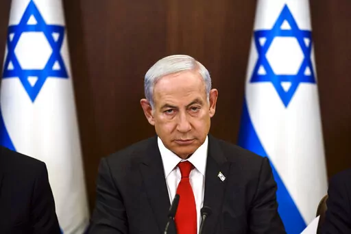 Israeli Prime Minister Benjamin Netanyahu convenes a weekly cabinet meeting at the Prime Minister's office in Jerusalem, Sunday, Jan. 8, 2023. (Ronen Zvulun/Pool Photo via AP)