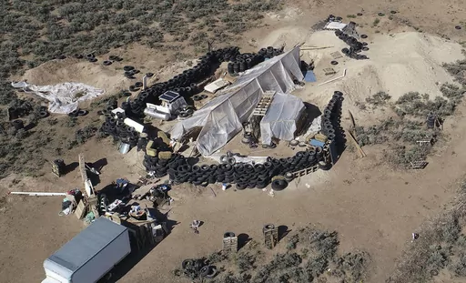 A ramshackle compound is seen in the desert area of Amalia, N.M., on Aug. 10, 2018. A U.S. judge is expected to hand down sentences Wednesday, March 6, 2024, for five defendants in a federal terrorism and kidnapping case that stemmed from the search for a toddler who went missing from Georgia in late 2017 that ended months later with a raid on the squalid compound in northern New Mexico. (AP Photo/Brian Skoloff, File)