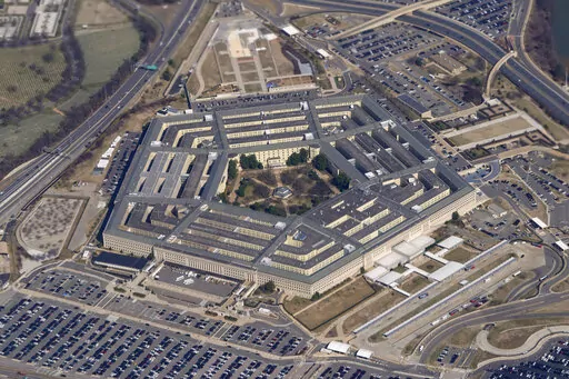 The Pentagon is seen from Air Force One as it flies over Washington, March 2, 2022. Years after about 1,900 National Guard and Reserve soldiers were swept up in a recruting bonus scandal, U.S. Army investigators have launched a review saying that some individuals may have been wrongly blamed and punished, The Associated Press has learned. (AP Photo/Patrick Semansky, File)