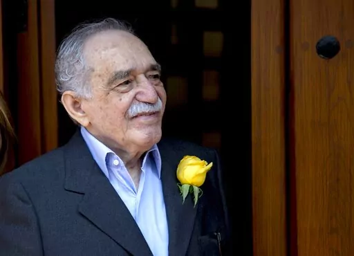 Colombian Nobel Literature laureate Gabriel Garcia Marquez greets fans and reporters outside his home on his 87th birthday in Mexico City, March 6, 2014. It was reported Sunday Jan. 16, 2022 that the late Garcia Marquez had a daughter out of wedlock in Mexico. (AP Photo/Eduardo Verdugo, File)