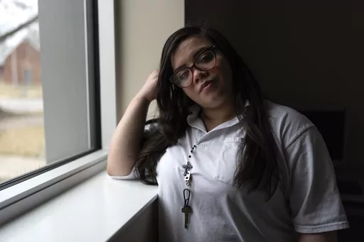 31-year-old Crystal Martinez stands for a portrait after speaking about her experiences with domestic violence and life in prison without her children Friday, Jan. 26, 2024, at Logan Correctional Center in Lincoln, Ill. Martinez's eight-year sentence for shooting a man she said was beating his girlfriend at the time was recently reduced under an Illinois law that allows survivors of domestic violence to ask for shorter sentences. (AP Photo/Erin Hooley)
