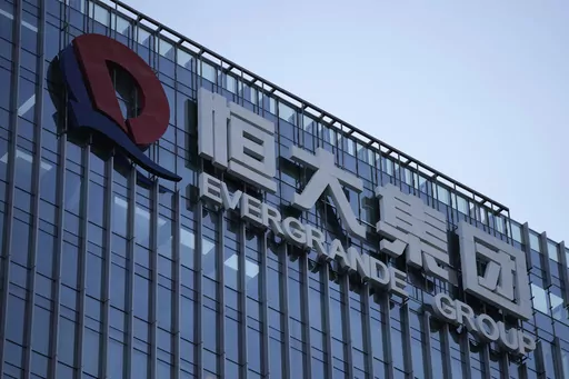 The Evergrande Group headquarters logo is seen in Shenzhen in southern China's Guangdong province on Sept. 24, 2021. Shares of debt-laden property developer China Evergrande Group soared Tuesday, Oct. 3, 2023, after they resumed trading in Hong Kong following a suspension last week. (AP Photo/Ng Han Guan, File)