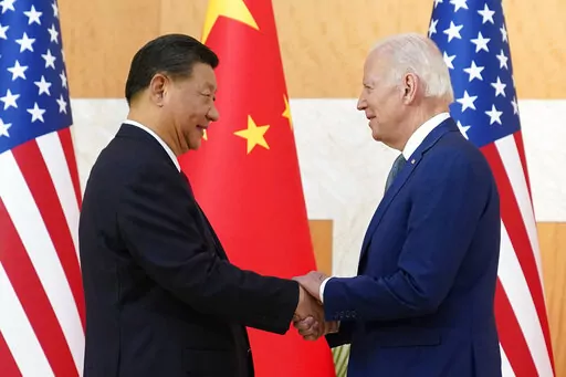 U.S. President Joe Biden, right, and Chinese President Xi Jinping shake hands before their meeting on the sidelines of the G20 summit meeting, Monday, Nov. 14, 2022, in Nusa Dua, in Bali, Indonesia. (AP Photo/Alex Brandon)