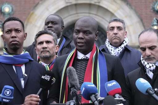 South Africa's Minister of Justice and Correctional Services Ronald Lamola, center, and Palestinian assistant Minister of Multilateral Affairs Ammar Hijazi, right, address the media outside the International Court of Justice in The Hague, Netherlands, Thursday, Jan. 11, 2024. Fighting “human animals.” “No uninvolved civilians in Gaza.” Making Gaza a “slaughterhouse.” These are just some of the comments made by Israeli leaders, soldiers and entertainers about Palestinians in Gaza sinc