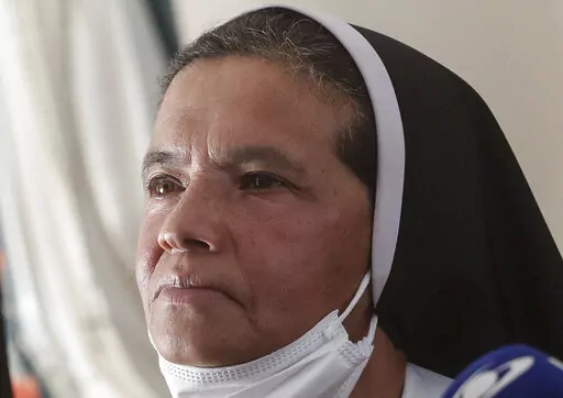 FILE — Colombian nun Gloria Cecilia Narvaez, who was held captive for nearly five years by al-Qaida-linked militants, listens to a question during a press conference in Bogota, Colombia, in this Friday, Nov. 19, 2021 file photo. Pope Francis authorized spending up to 1 million euro to free Narvaez, Cardinal Angelo Becciu testified at the Vatican's big financial fraud trial Thursday, May 5, 2022, revealing previously top secret negotiations that Francis authorized to hire a British security and