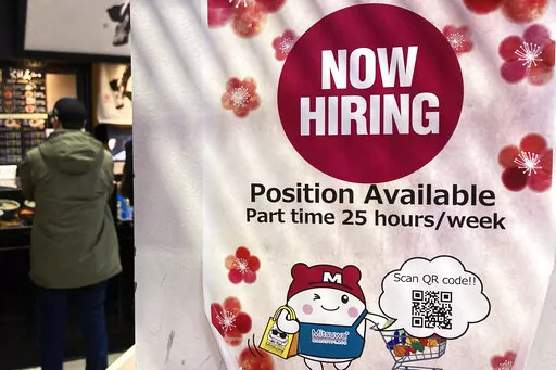 A hiring sign is displayed at a grocery store in Arlington Heights, Ill., Tuesday, Dec. 27, 2022. On Thursday, the Labor Department reports on the number of people who applied for unemployment benefits last week. (AP Photo/Nam Y. Huh, File)
