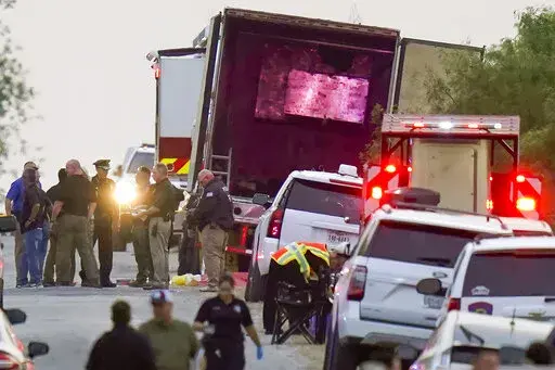 Police and other first responders work the scene where officials say dozens of people have been found dead and multiple others were taken to hospitals with heat-related illnesses after a semitrailer containing suspected migrants was found, Monday, June 27, 2022, in San Antonio. Following the horror of 53 migrants found dead or dying in Texas. The deadliest smuggling attempt in U.S. history illustrated the limitations of Texas Gov. Greg Abbott's massive border apparatus after 53 migrants were fou