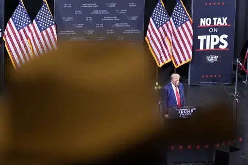 A supporter listens as Republican presidential nominee former President Donald Trump speaks during a campaign event, Sept.12, 2024, in Tucson, Ariz. (AP Photo/Alex Brandon, File)