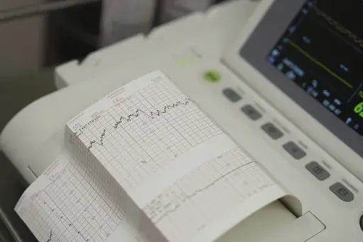 A cardiotocograph measures Denise Jones' contractions and her baby's heart rate during a prenatal appointment at the Oklahoma State University obstetrics and gynecology clinic in Tulsa, Okla., on Tuesday, July 16, 2024. (AP Photo/Mary Conlon)