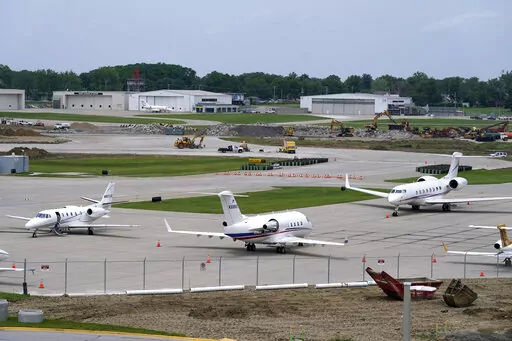Planes sit on the tarmac at the Des Moines International Airport, Monday, June 13, 2022, in Des Moines, Iowa. With an eye on the upcoming July Fourth weekend, airlines are stepping up their criticism of federal officials over recent widespread flight delays and cancellations. The industry trade group Airlines for America said Friday, June 24, 2022, that understaffing at the Federal Aviation Administration is crippling traffic along the East Coast. (AP Photo/Charlie Neibergall, File)