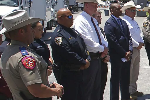 Uvalde School Police Chief Pete Arredondo, third from left, stands during a news conference outside of the Robb Elementary school in Uvalde, Texas Thursday, May 26, 2022.  The district’s superintendent said Wednesday, June 22 that Arredondo has been put on leave following allegations that he erred in his response to a mass shooting at an elementary school that left 19 students and two teachers dead.  (AP Photo/Dario Lopez-Mills, File)