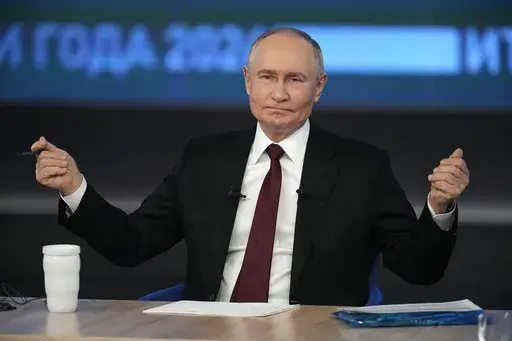 Russian President Vladimir Putin gestures while speaking during his annual news conference and call-in show at Gostinny Dvor in Moscow, Russia, Thursday, Dec. 19, 2024. (AP Photo/Alexander Zemlianichenko)