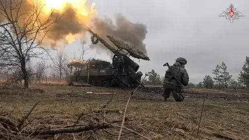 In this photo taken from video distributed by Russian Defense Ministry Press Service on Sunday, March 30, 2025, a Russian Army 2S5 howitzer Giatsint-S fires towards Ukrainian positions in Ukraine. (Russian Defense Ministry Press Service via AP)