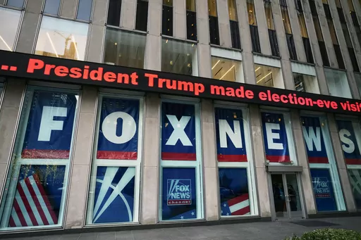 A headline about President Donald Trump is displayed outside Fox News studios in New York on Nov. 28, 2018. (AP Photo/Mark Lennihan, File)