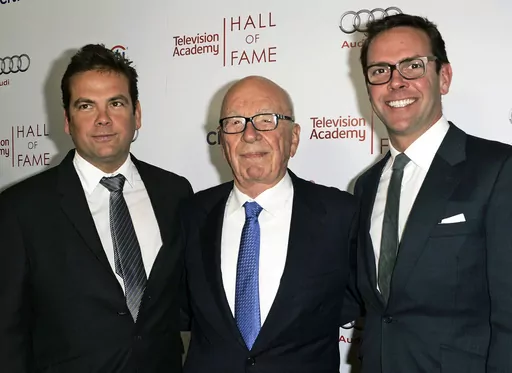 News Corp. Executive Chairman Rupert Murdoch, center, and his sons, Lachlan, left, and James Murdoch attend the 2014 Television Academy Hall of Fame in Beverly Hills, Calif., on March 11, 2014. Fox Corp. chief executive Lachlan Murdoch on Friday, April 21, 2023, dropped his defamation lawsuit against Australian news website Crikey, citing the Fox News settlement of a U.S. court case where the network agreed to pay almost $800 million over its lies involving the 2020 U.S. presidential election. (