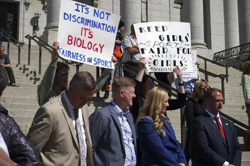 Lawmakers listen as parents speak about the prospect of their children competing against transgender girls in school sports at the Utah State Capitol on March 25, 2022, in Salt Lake City. A federal judge on Monday, June 17, 2024 temporarily blocked the Biden administration’s new Title IX rule expanding protections for LGBTQ+ students in six additional states, dealing another setback for a new policy that has been under legal attack by Republican attorneys general. (AP Photo/Samuel Metz, File)