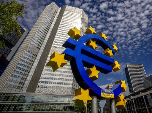 The Euro sculpture stands in front of the former European Central Bank in Frankfurt, Germany, on July 13, 2022. The euro has fallen below parity with the dollar, diving to its lowest level in 20 years and ending a one-to-one exchange rate with the U.S. currency. .(AP Photo/Michael Probst)