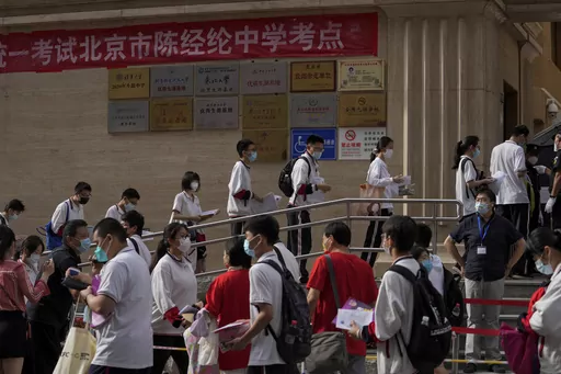 Students line up to enter a school for the first day of China's national college entrance examinations, known as the gaokao, in Beijing, Tuesday, June 7, 2022. After the pandemic, young Chinese are again looking to study abroad. But the decades-long run that has sent an estimated 3 million Chinese students to the U.S. could be trending down. (AP Photo/Andy Wong, File )