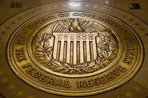 FILE- The seal of the Board of Governors of the United States Federal Reserve System is displayed in the ground at the Marriner S. Eccles Federal Reserve Board Building in Washington, Feb. 5, 2018. Facing the prospect of a third financial crisis in less than two decades, the Federal Reserve initiated a broad emergency lending program late Sunday, March 12, 2023, intended to shore up confidence in the nation's financial system following the collapse of two large banks with deep ties to the tech i