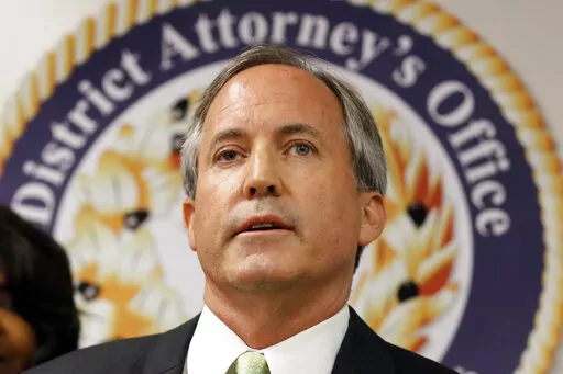 In this June 22, 2017 file photo, Texas Attorney General Ken Paxton speaks at a news conference in Dallas. As Paxton seeks to fend off legal troubles and win a third term as Texas' top law enforcement official, his agency has come unmoored by disarray behind the scenes, with seasoned lawyers quitting over practices they say aim to slant legal work, reward loyalists and drum out dissent. (AP Photo/Tony Gutierrez, File)