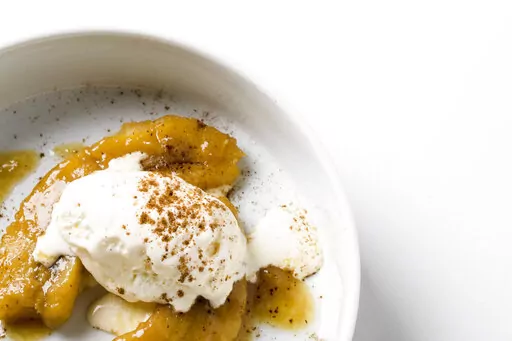 This image released by Milk Street shows a recipe for miso-spiced rum bananas foster. (Milk Street via AP)
