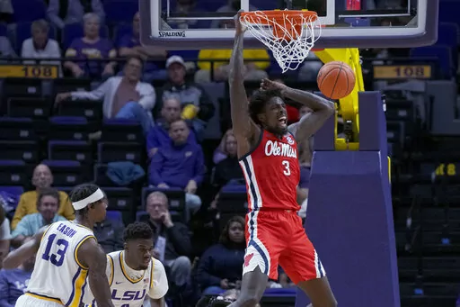 Mississippi center Nysier Brooks (3) dunks against LSU during the first half of an NCAA college basketball game in Baton Rouge, La., Tuesday, Feb. 1, 2022. (AP Photo/Matthew Hinton)